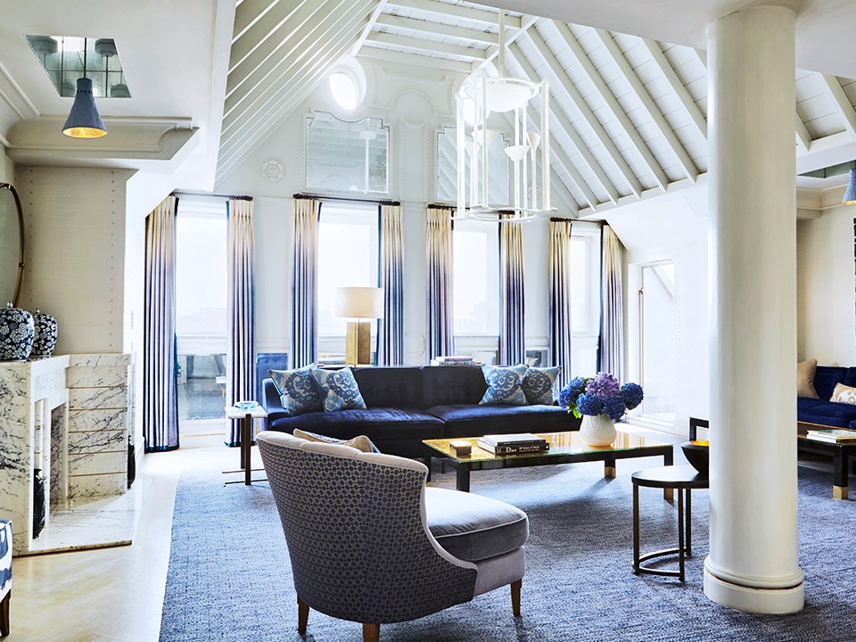 View of a modern interior, with lots of space, daylight, and luxurious furnishings at The Connaught.