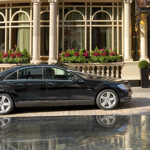 Luxury chauffeur service at The Connaught, featuring a Mercedes S-Class service.