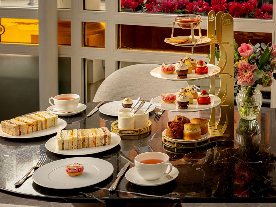 Spring Afternoon Tea spread at The Connaught, with tea, sandwiches, scones, and desserts.