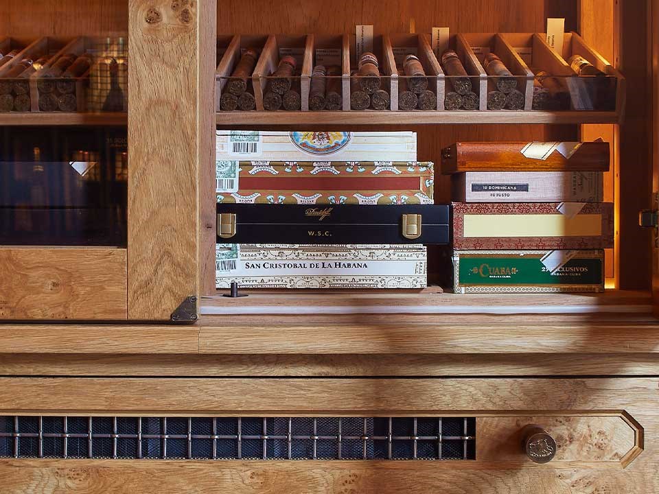 A rich collection of Cuban cigars is arranged in the interior of The Connaught Cigar Merchants.