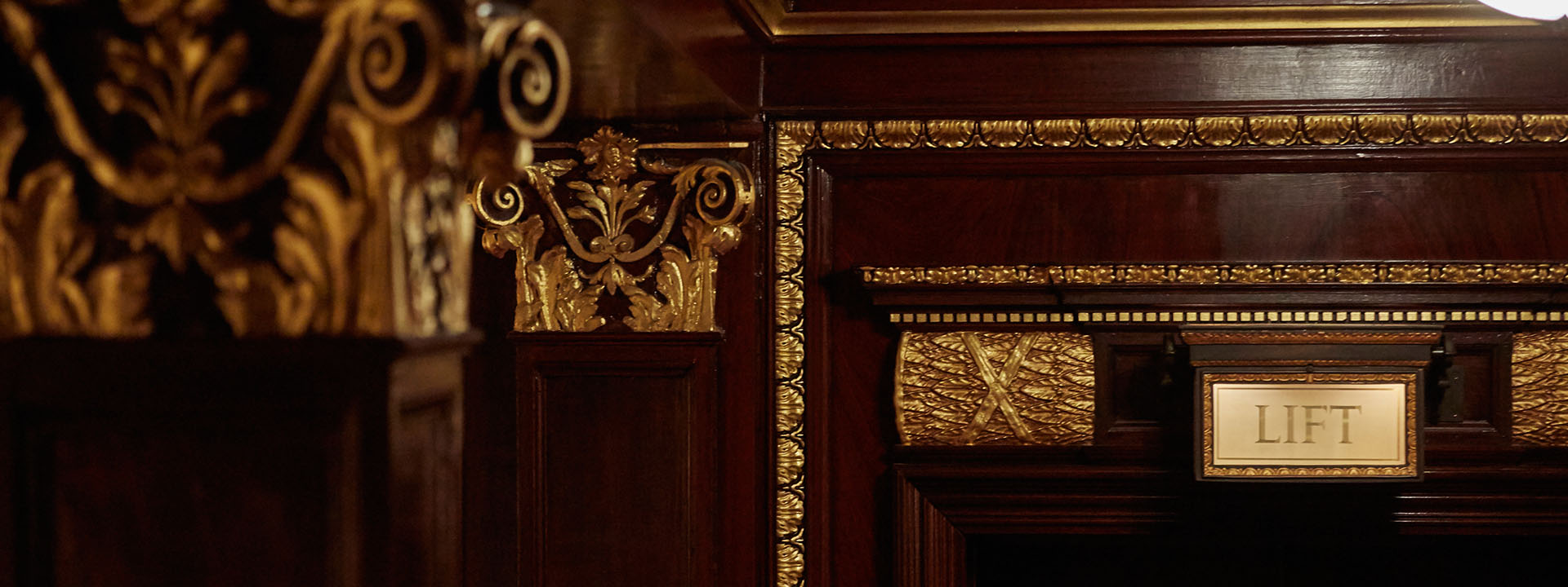 A closeup shot showing the golden details on the wood work.