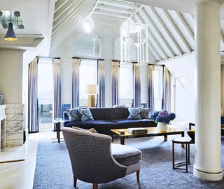 View of a modern interior, with lots of space, daylight, and luxurious furnishings at The Connaught.