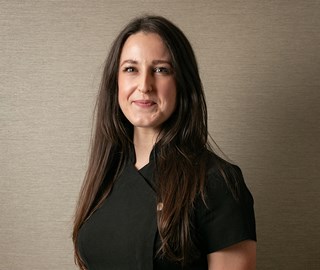 Portrait of a smiling Rebecca Whaley, one of the Aman Spa experts at The Connaught.