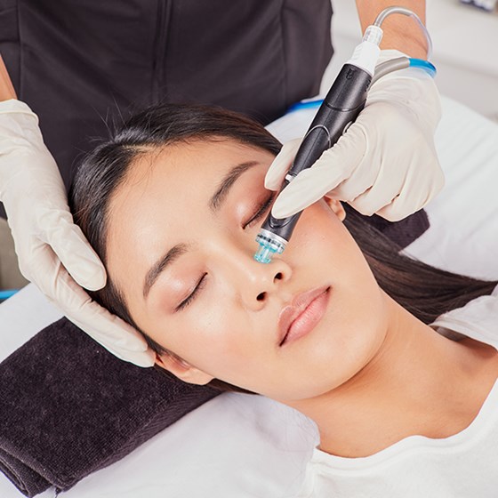 Woman having high tech hydrofacial treatment done