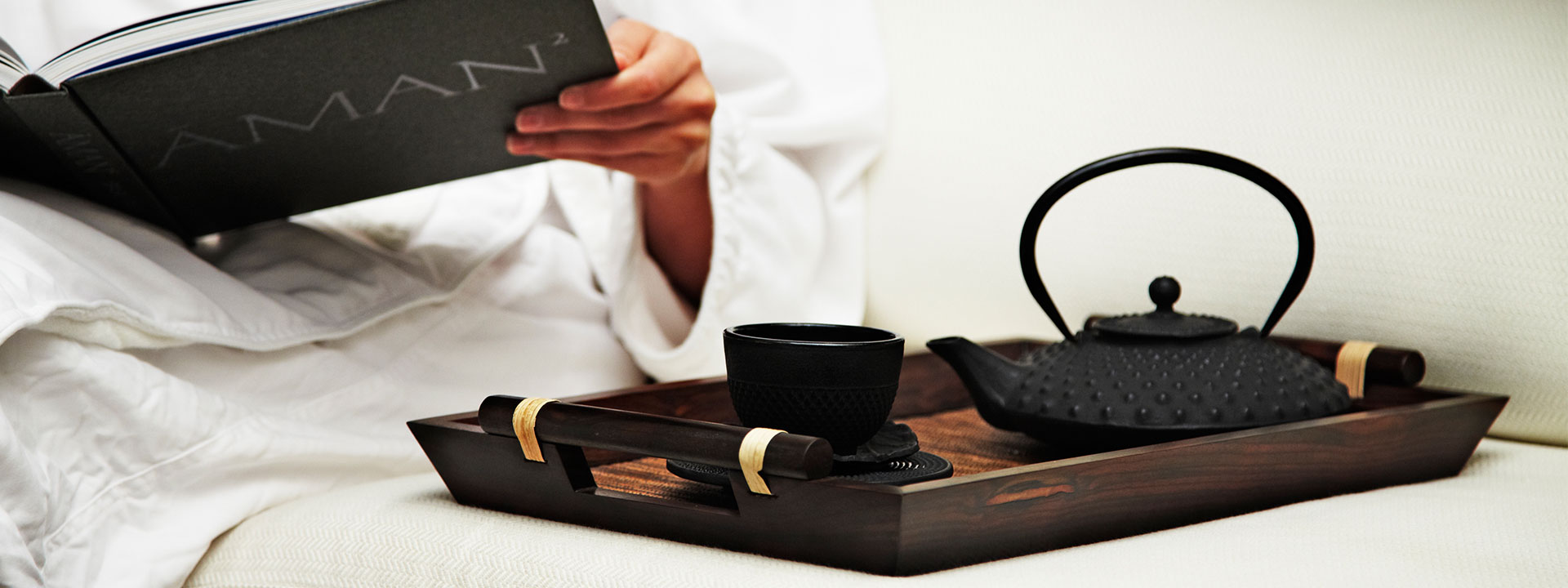 View the relaxed atmosphere with tea and reading a book at Aman Spa by The Connaught.