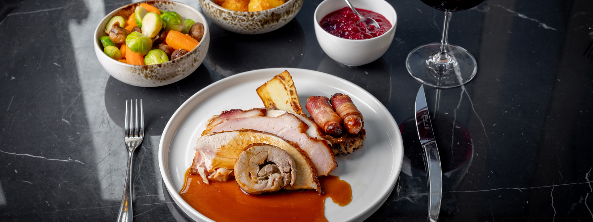 One of the delicious dishes from the festive menu at The Connaught, roast bronze turkey and ham with cranberry sauce.