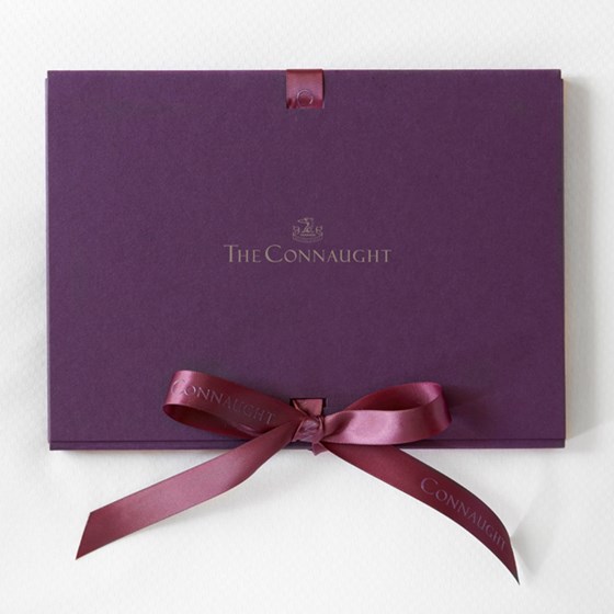 A view of the gift certificate in glorious purple and with a bow, from The Connaught.