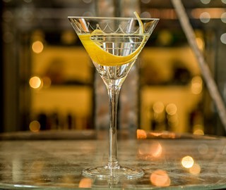 Presentation of the martini drink by the glass, one of the prides of Connaught Bar in Mayfair.