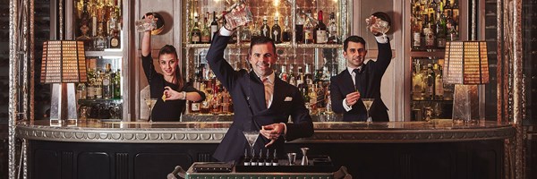 The Connaught Bar - staff pouring drinks in front and behind the bar.