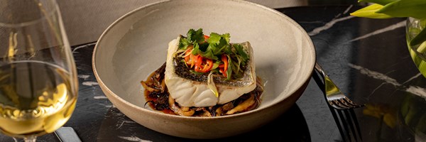 Steamed white fish with crispy skin, served on mushrooms with chilli, coriander, and soy dressing.