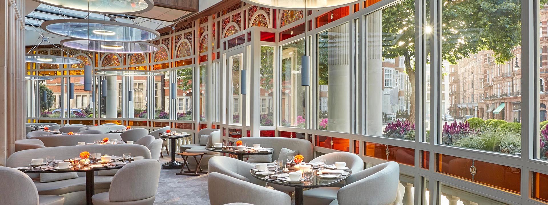 View of the space Jean-Georges at The Connaught, with dining tables, and lots of daylight.