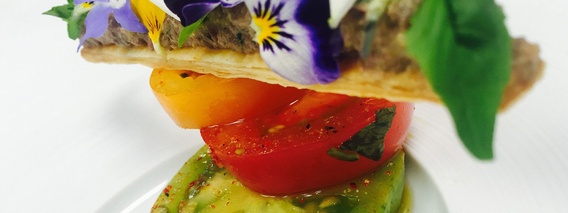 An exquisite dish of tomato burrata.