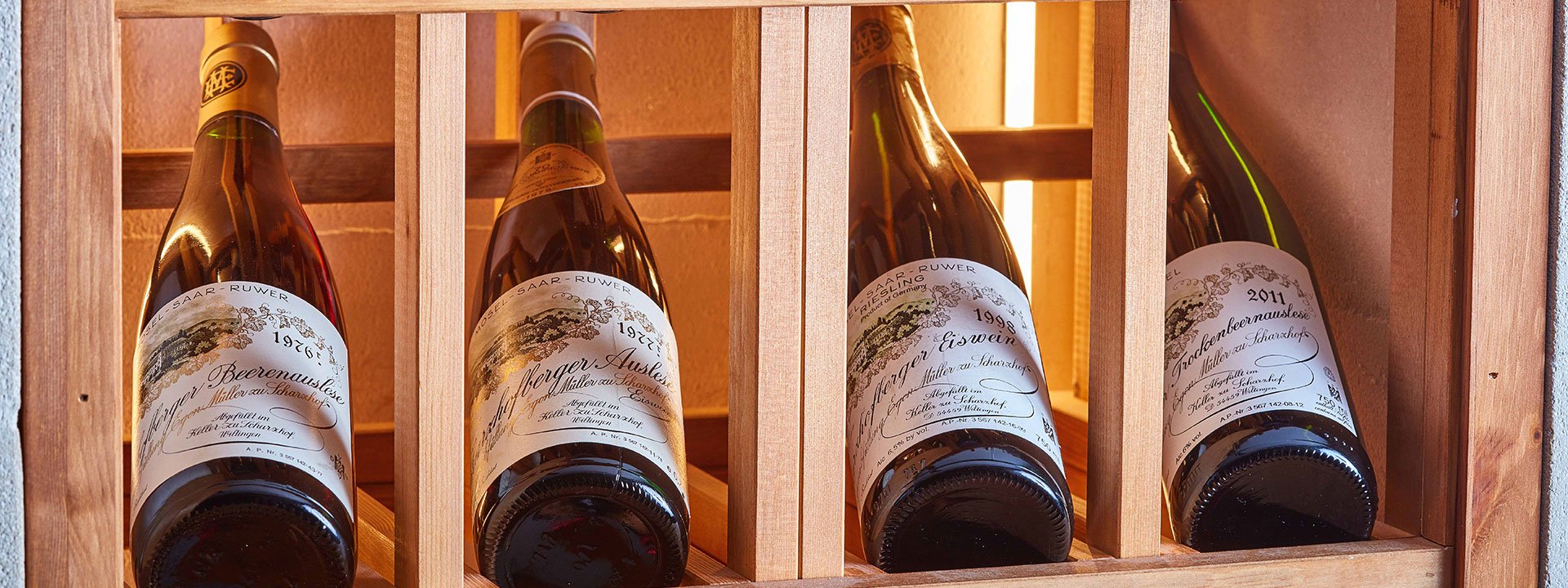 A collection of wines chronologically arranged on a shelf can be ordered from The Sommelier's Table.