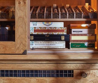 A rich collection of Cuban cigars is arranged in the interior of The Connaught Cigar Merchants.