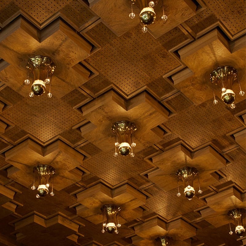 The Connaught Cigar Merchants detail shot of the roof made of wood with lights.