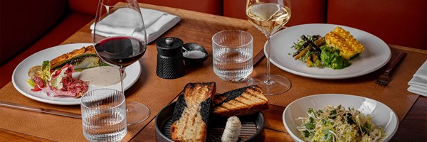 3 Connaught Grill Dishes with a glass of red wine and a glass of white wine, and a  plate of bread