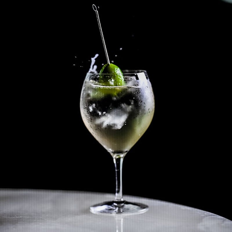 Martini in a martini glass with an olive, image taken in the Blue Bar at The Berkeley