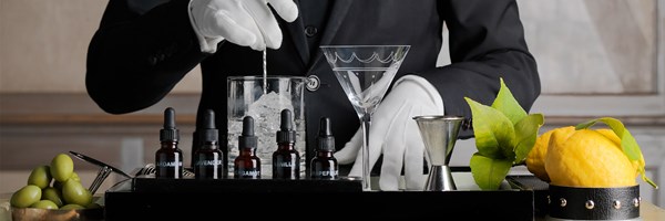 Man with white gloves making a martini trolley