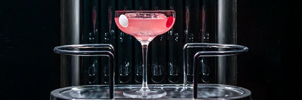 pink cocktail in cocktail glass coupe