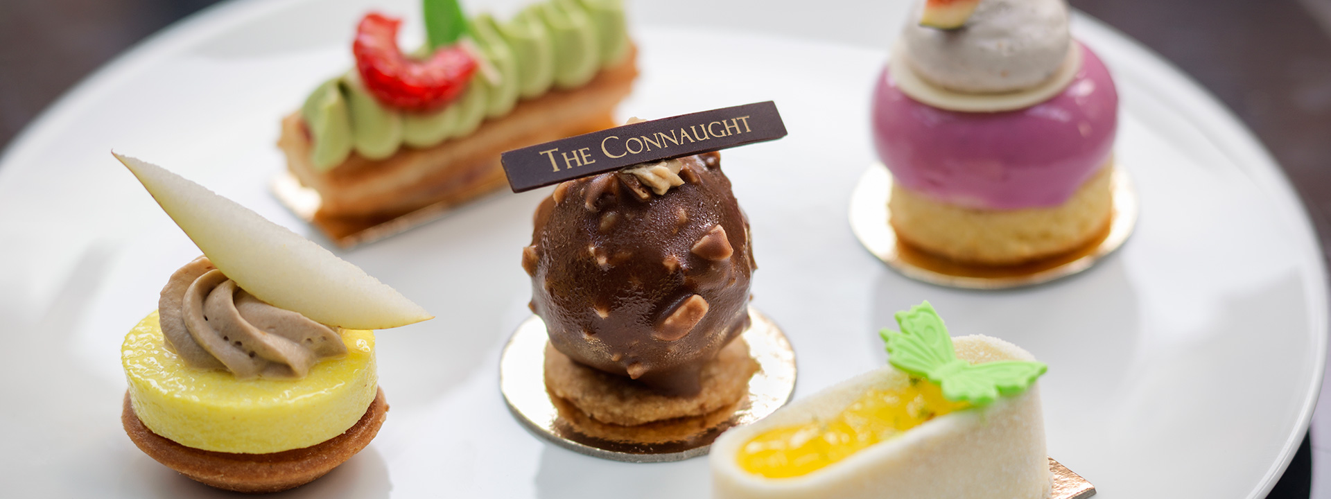 Sweet canap�s in The Connaught, presented on a white plate, creatively decorated and assembled.