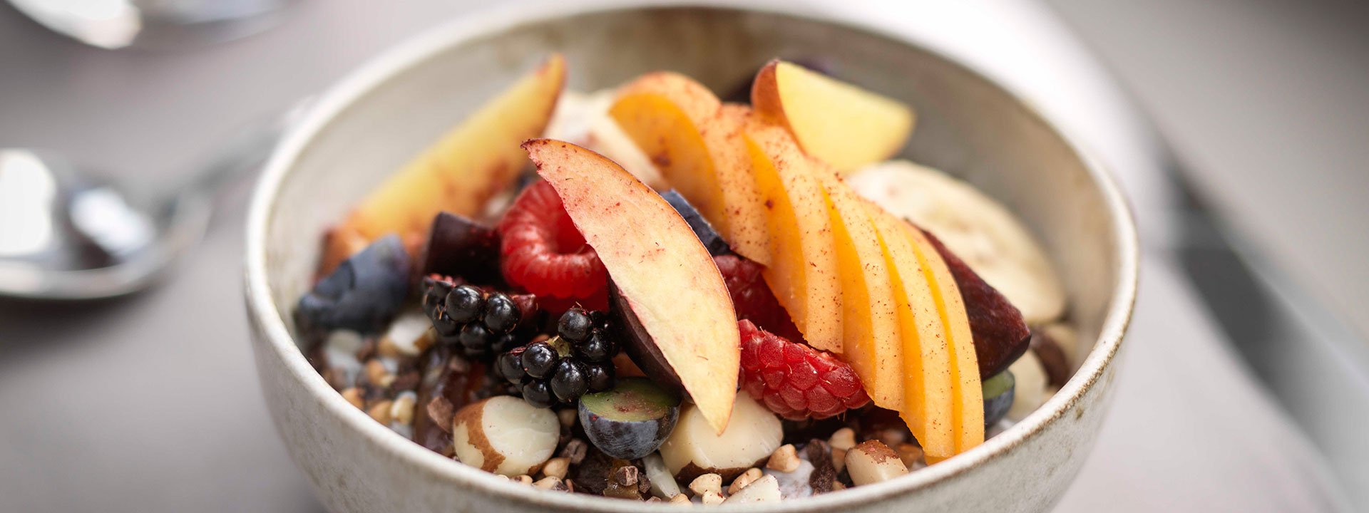 Breakfast at The Connaught, with lots of fresh fruit in a bowl, with a healthy start to the day.