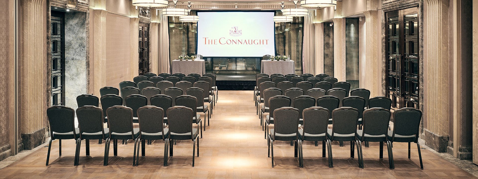 A presentation setup in the flexible Mayfair Room, showing the spaciousness for any event, at The Connaught.