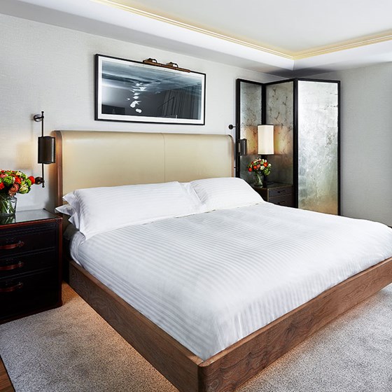 A view of the modern classic bedroom interior with a King Bed in the Contemporary Deluxe Room.