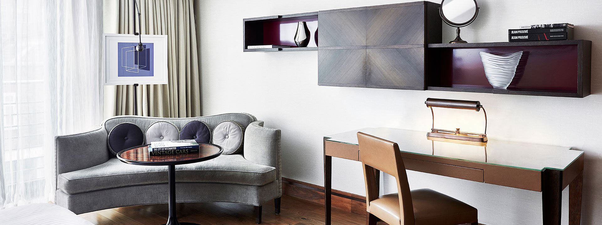 A view of the luxury furniture and walnut parquet flooring in the Contemporary Deluxe Room.