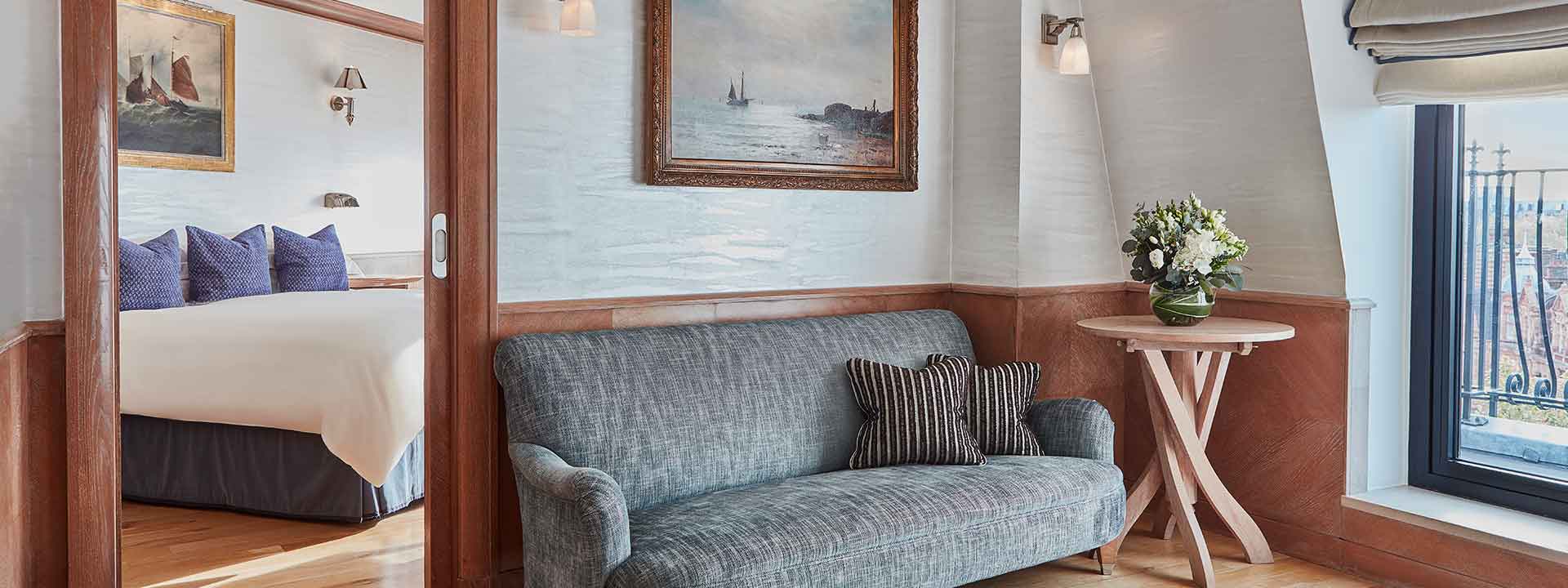 A view of the study room and comfortable sofa in the nautical style interior of The Eagles Lodge, in The Connaught.