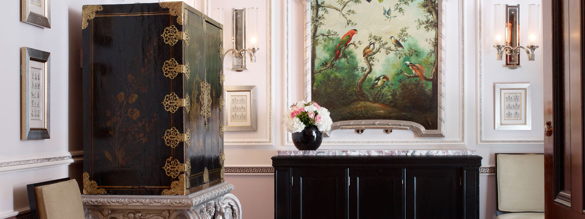 View of the antique features and furnishings including oil paintings in the Sutherland Suite.