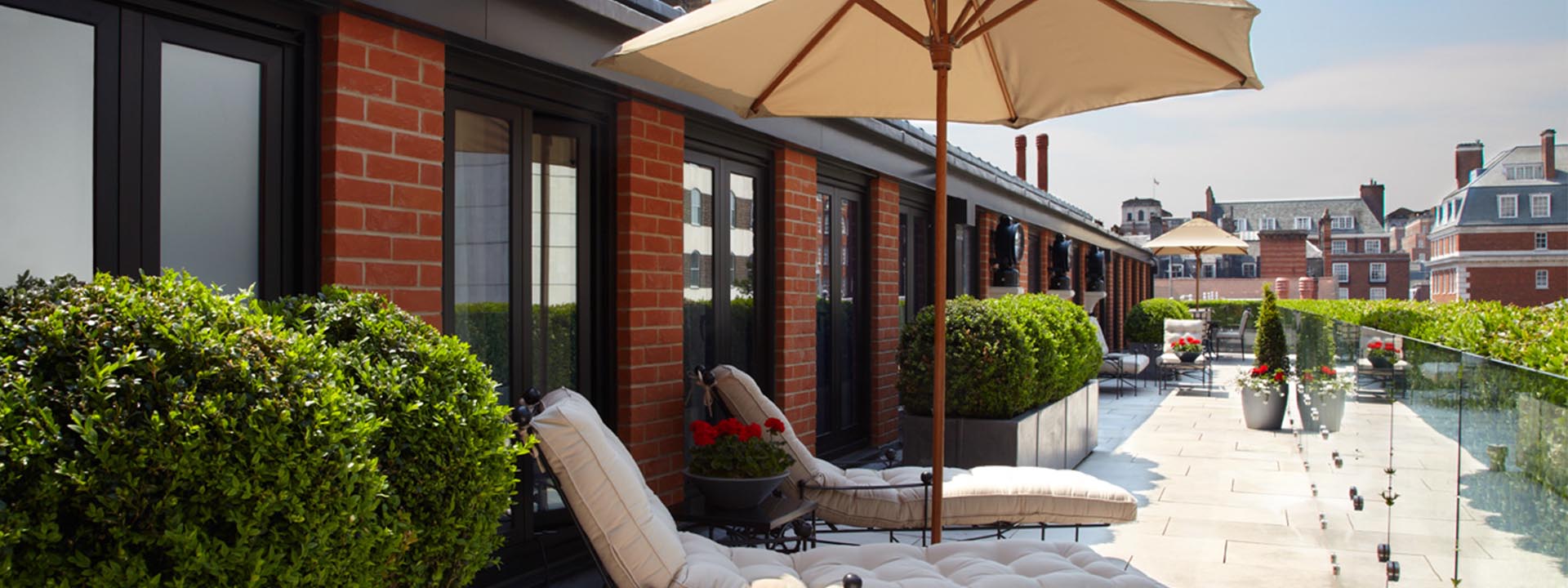 The spaciousness of the terrace in the Terrace Suite at The Connaught, with its sun loungers and parasols.