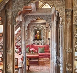 View point of looking down the centre of The King's Lodge with intricately carved wooden separators