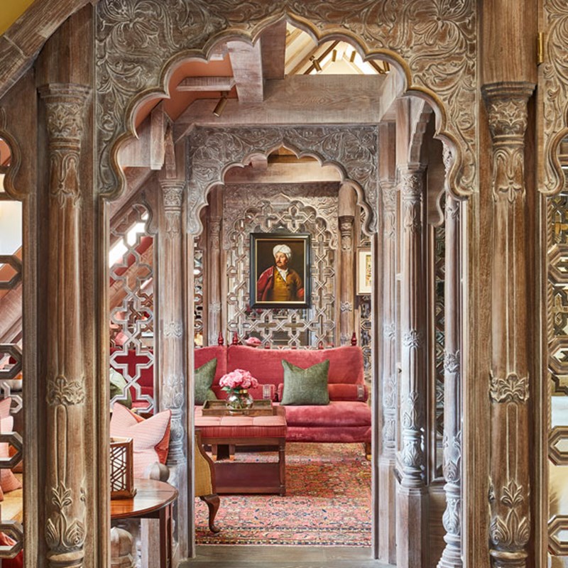 View point of looking down the centre of The King's Lodge with intricately carved wooden separators