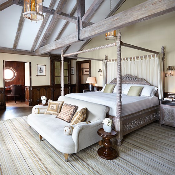 A view of the King Bed in The Prince's Lodge, with handcrafted furniture from Kabul in an elegant interior.